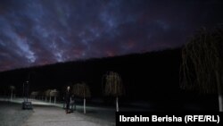 Selimi runs through Germia Park as the first rays of light pierce the night sky.