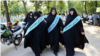 Female members of Iran's morality police patrol the streets in Tehran looking for women violating the mandatory law on wearing head scarves. 