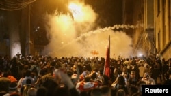 Tens of thousands of protesters have taken to the streets of Tbilisi and other cities over the controversial "foreign agent" bill approved by parliament.