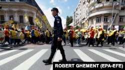 Romanian teachers march through downtown Bucharest during a union protest on May 10.