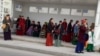 Женщины на остановке общественного транспорта. Ашхабад, март, 2024. 