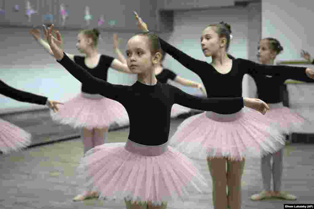 Girls practice ballet in a bomb shelter in Kharkiv, Ukraine.