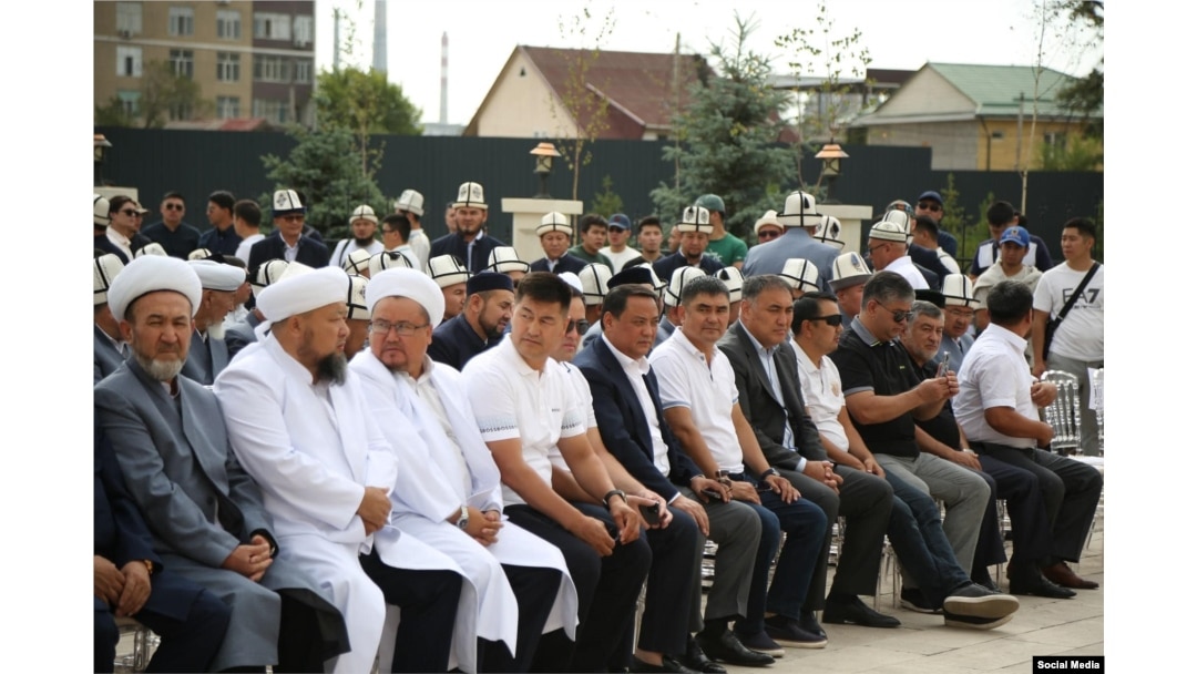 Raimbek Matraimov (front-row center, in dark jacket) and members of parliament at the August 27 opening of the Muftiate building in Bishkek.