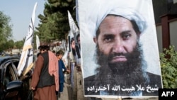 A poster of Taliban Supreme Leader Mullah Haibatullah Akhundzada is seen along a road in Kabul. (file photo)