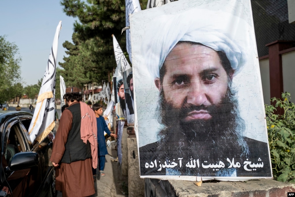 A poster of Taliban Supreme Leader Hibatullah Akhundzada is seen along a road in Kabul.