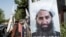 A poster of the Taliban's spiritual leader, Hibatullah Akhundzada, is seen along a road in Kabul in 2023.