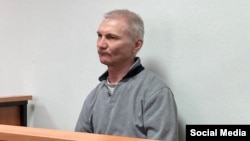 Aleksei Moskalyov was sentenced to two years in prison in absentia by a Russian court after it convicted him of "discrediting Russia's armed forces," a charge Russian authorities have been using against any criticism of the war in Ukraine. 