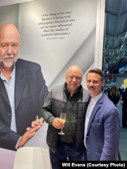 Andrey Kurkov (left) and publisher Will Evans at the Frankfurt Book Fair in October.