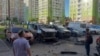 A damaged car is seen in a parking spot following a blast that reportedly injured an officer from Russia's GRU military intelligence, in Moscow on July 24.