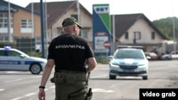 Serbian police at the Lipnicki Sor checkpoint in the city of Loznica in western Serbia, where two policemen were shot, one of them fatally, on July 18. 