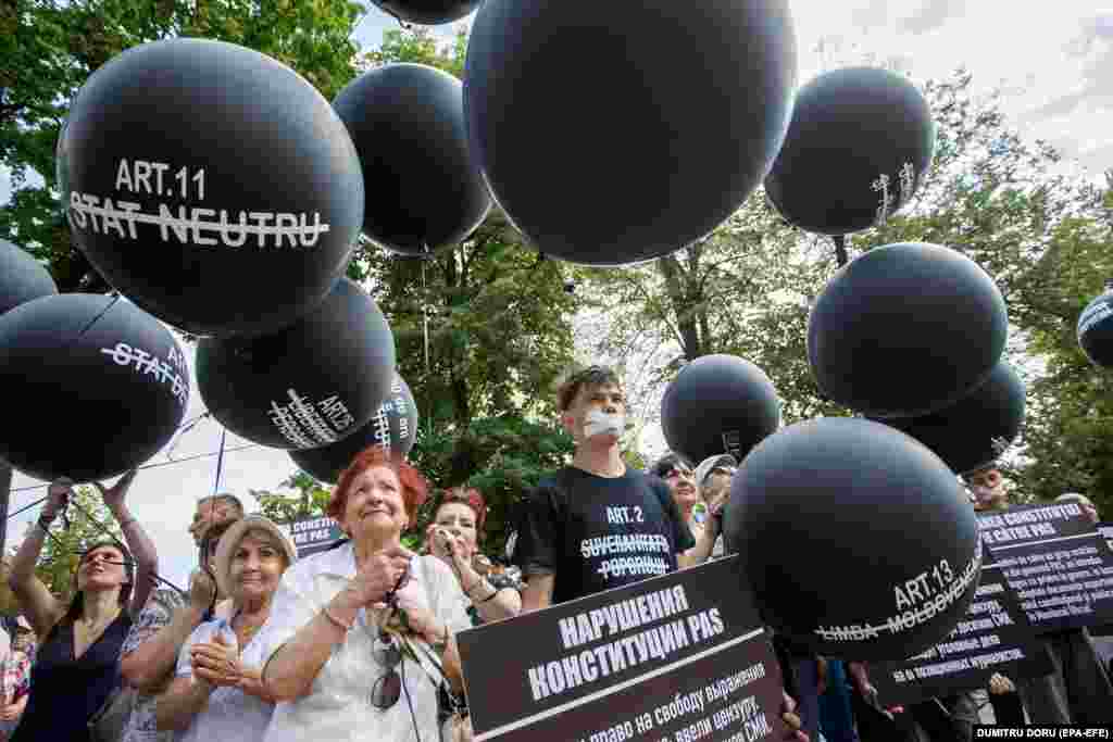 Supporters of the Victory political bloc attend a protest in front of parliament in Chisinau. Supporters protested against the Party of Action and Solidarity government, accusing the Moldovan authorities of political pressure on the opposition and violations of Moldova&#39;s constitution.