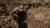 A soldier practices a trench assault, a type of warfare that is at the heart of Ukrainian attempts to break through Russian defenses.