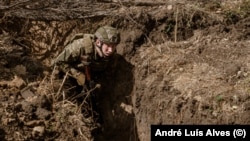 A soldier practices a trench assault, a type of warfare that is at the heart of Ukrainian attempts to break through Russian defenses.