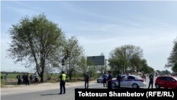 Kyrgyz police are seen in Dmitrievka after the incident on May 17.