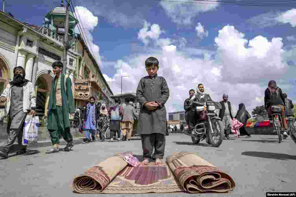 An Afghan boy prays after Friday Prayers during the Muslim holy fasting month of Ramadan, in Kabul on March 31.