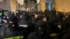 Georgian police face off with protesters outside parliament on March 2.