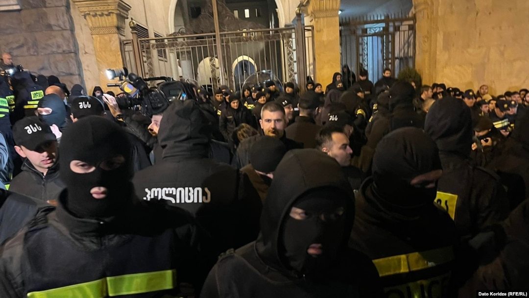 Georgian police face off with protesters outside parliament on March 2.