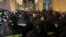 Georgian police face off with protesters outside parliament on March 2.