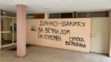 Novi Sad, Serbia--Threatening graffiti to journalist and university professor Dink Gruhonjic at the entrance to his building, March 22, 2024