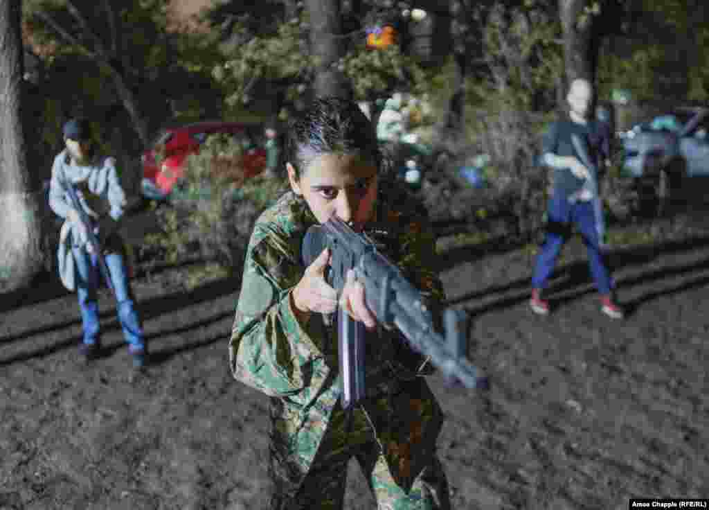 A young woman undergoes weapons drilling. Arsen, a young English-speaking spokesman for the group, told RFE/RL the numbers who sign up for the trainings surge after each new flare-up of violence with Azerbaijan.&nbsp;