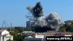 Clouds of smoke are seen over the headquarters of the Russian Black Sea Fleet in Sevastopol, Crimea, after a missile attack by Ukrainian forces on September 22.