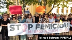 People protest against domestic violence in Mostar, Bosnia-Herzegovina, on August 14 following a triple murder in Gradacac.