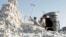 Uzbek men work at a cotton reception point outside the capital, Tashkent, in September 2023. 