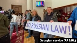 Journalists protested against the draft bill at Georgia's parliament in Tbilisi on February 20.