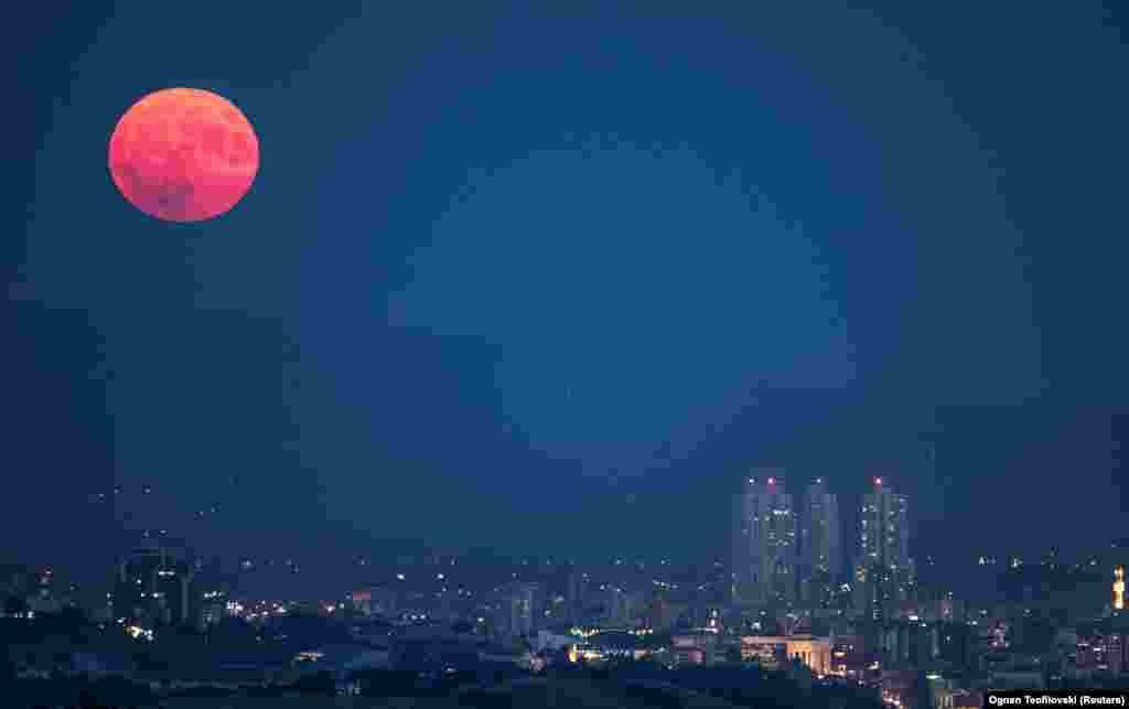 A full moon known as the Sturgeon Moon rises over Skopje on August 1.