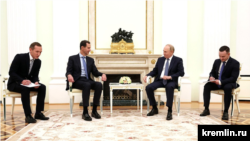 Russian President Vladimir Putin (center right) met with Syrian President Bashar al-Assad (center left) on July 25.
