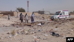 Pakistani security officials examine the site of a deadly bomb attack targeting a procession in Balochistan on September 29. 