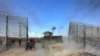 A construction vehicle breaks into the Israeli side of the Israel-Gaza border fence on October 7, 2023. The extremist group Hamas carried out an unprecedented, multi-pronged attack on Israel, firing thousands of rockets as dozens of Hamas fighters infiltrated the heavily fortified border in several locations by air, land, and sea and catching the country off-guard on a major holiday. Hamas has been designated by the United States and the EU as terrorist group and is a key member of Iran&#39;s axis.