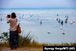 Sailboats compete in the Blue Ribbon yachting race around Lake Balaton in July 2019.