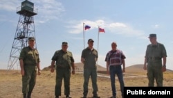 Armenia - Russian Ambassador Sergei Kopyrkin poses for a photograph with Russian border guards on Armenian-Turkish border, August 12, 2022.