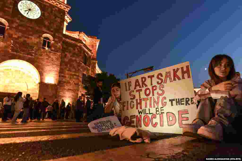 Armenian protesters display signs outside the government building in central Yerevan on September 20.