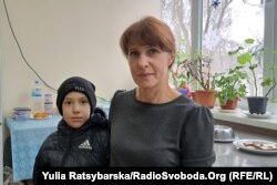 Valentyna Romanyuk and her son at the Dnipro shelter