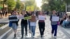 Members of Feminita march in Almaty, demanding a life sentence for former Economy Minister Quandyq Bishimbaev, on May 13.
