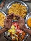 PAKISTAN -- A Muslim devotee offers prayers before breaking his fast during the Islamic holy month of Ramadan in Karachi on March 13, 2024. 