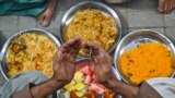 PAKISTAN -- A Muslim devotee offers prayers before breaking his fast during the Islamic holy month of Ramadan in Karachi on March 13, 2024. 