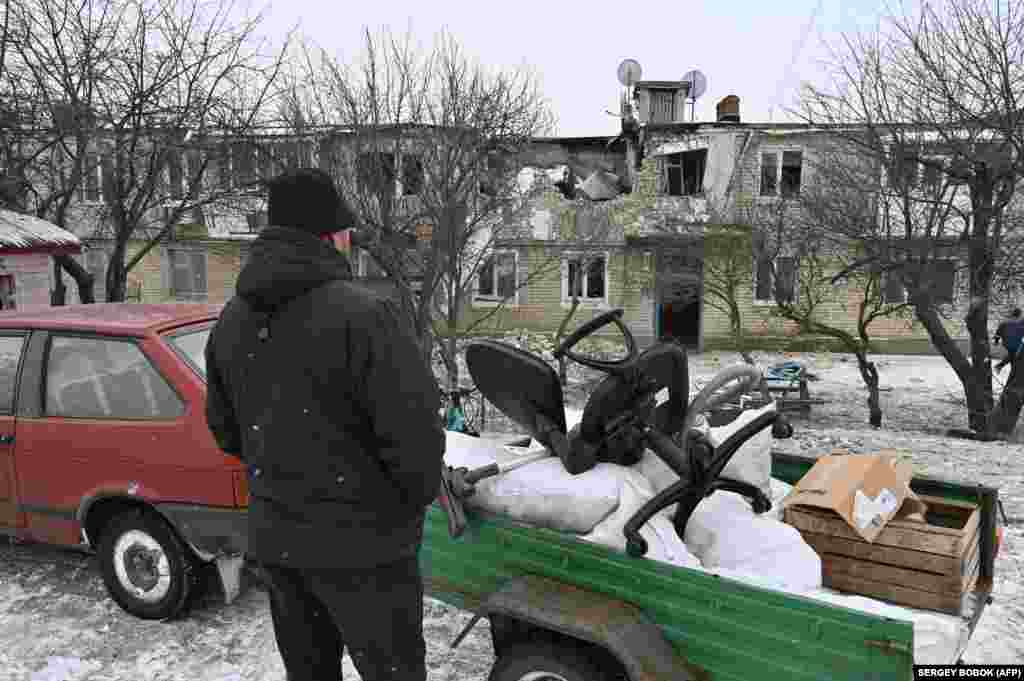 A resident of&nbsp;Kupyansk collects possessions from his home on February 13 after it was destroyed by Russian shelling. The city is located in&nbsp;eastern Ukraine&#39;s&nbsp;Kharkiv region, where locals worry about&nbsp;another Russian offensive and occupation.