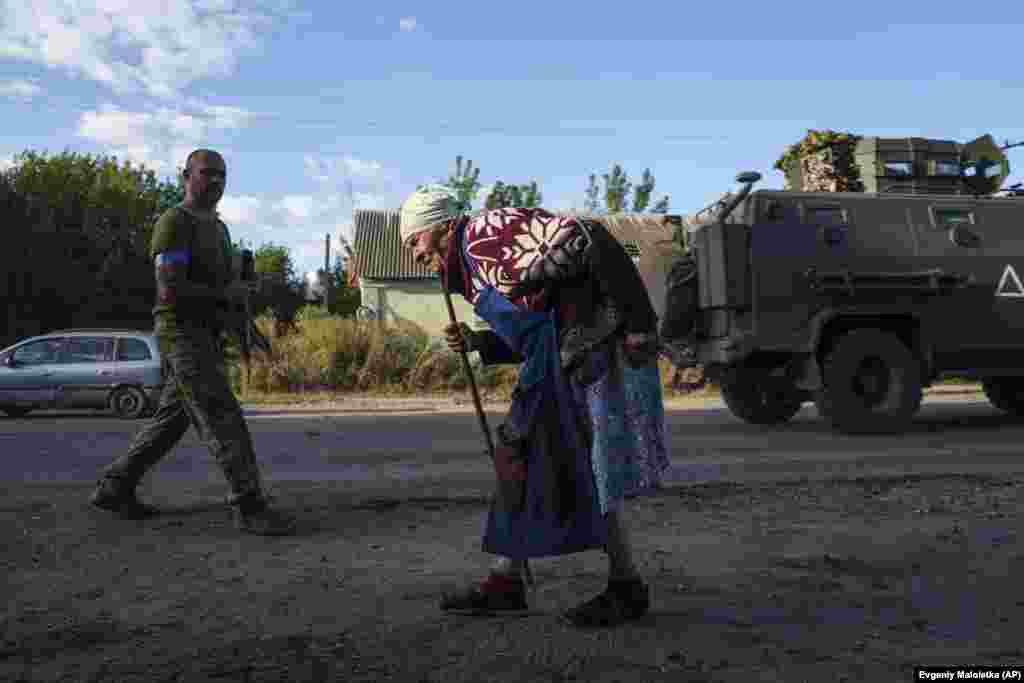 An elderly woman walks along the road near the Russian-Ukrainian border in Ukraine&#39;s Sumy region.&nbsp;