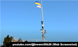 Попытка снять украинский флаг на набережной Ялты, 13 марта 2014 года