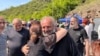 Armenia - Archbishop Bagrat Galstanian is greeted by a supporter during protests in Tavush region, April 29, 2024.