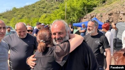 Armenia - Archbishop Bagrat Galstanian is greeted by a supporter during protests in Tavush region, April 29, 2024.