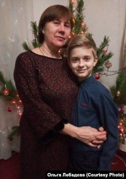 Ольга Лебедєва з онуком