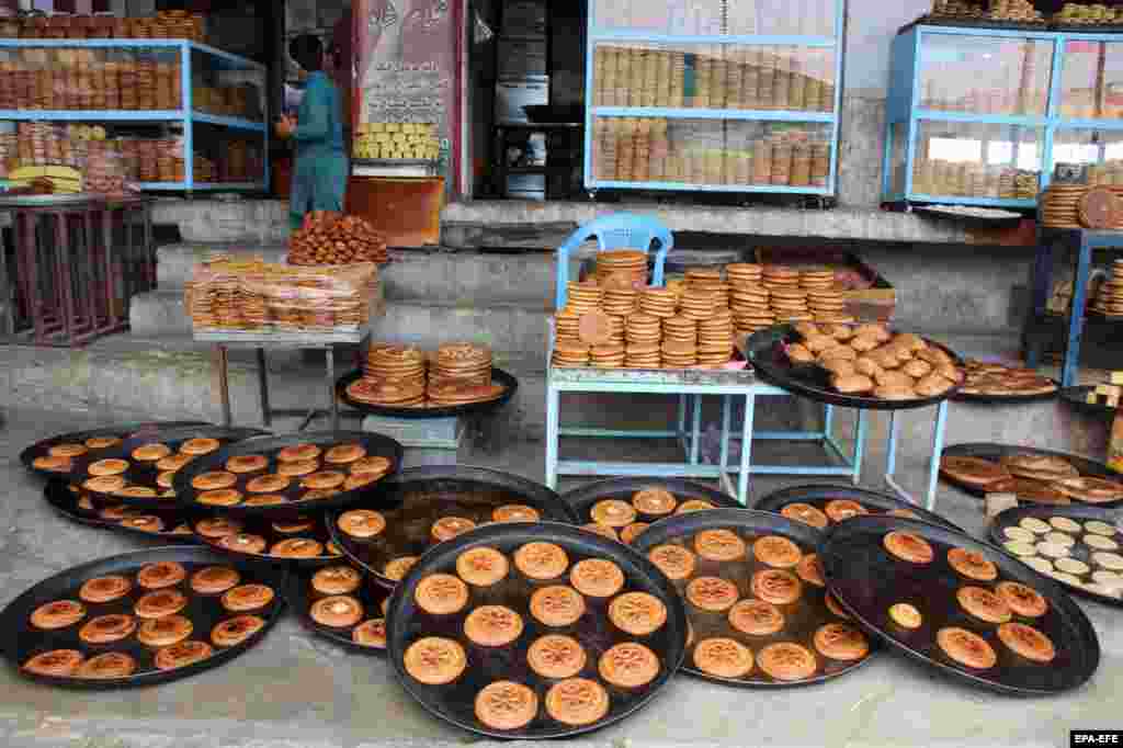 A vendor prepares traditional sweets in Kandahar, Afghanistan. Muslims around the world are celebrating the holy month of Ramadan by praying during the nighttime and abstaining from eating, drinking, and sexual acts during the period between sunrise and sunset.