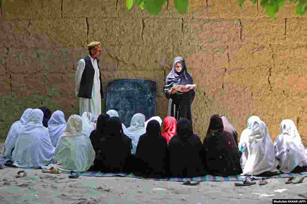 Afghan schoolgirls attend a class at an open-air primary school in the Khogyani district of Nangarhar Province.&nbsp;