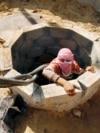A Palestinian smuggler prepares to smuggle fuel into Gaza through a tunnel beneath the Egyptian-Gaza border November 17, 2008