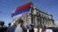 Banners saying "No to capitulation," "Serbia remembers," and "Resignation to Vucic" were unfurled in front of the government's headquarters.
