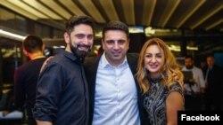 Armenia - Parliament speaker Alen Simonian poses for a photo with his brother Karlen and sister-in-law Ani Gevorgian.